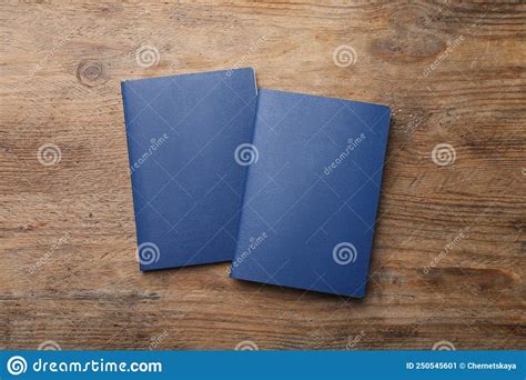 Blank Blue Passports On Wooden Table Flat Lay Stock Image Image Of Country Notebook 250545601