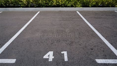 Close-up of a White Paint Number Marking in a Parking Lot. Empty ...