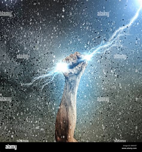 human hand holding lightning stock photo alamy