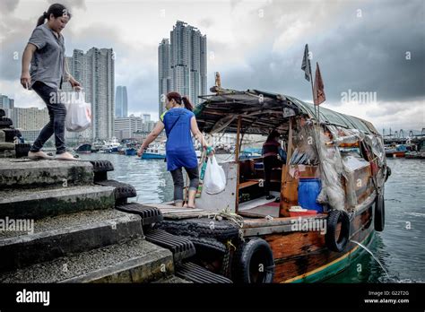 Ladies Boarding A Sampan In Sai Wan Ho Hong Kong Stock Photo Alamy