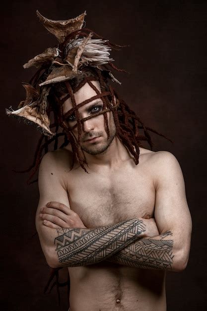 Premium Photo A Man With A Naked Torso On A Dark