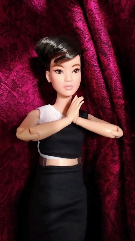Barbie Signature Looks Doll Petite Brunette Pixie Cut Fully Posable Fashion Doll Wearing