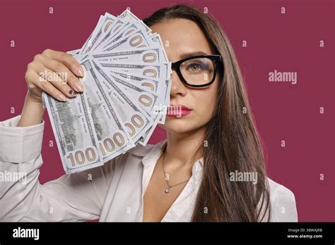 Beautiful Brunette Maiden With A Long Hair In Glasses Wearing In A Black Short Skirt And White