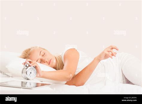 Blonde Woman Waking Up In Bed Stock Photo Alamy