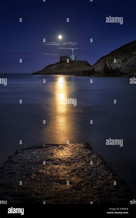 Moonlit Mumbles Lighthouse Stock Photo - Alamy