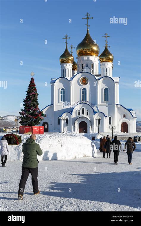 Parishioners on Christmas Eve walk to Holy Trinity Orthodox Cathedral ...