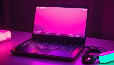 Um computador portátil sentado em cima de uma mesa fuschia leds