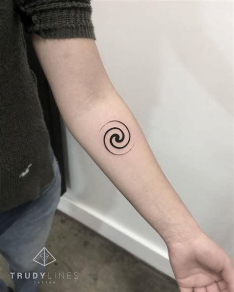 Small Spiral Tattoo On The Left Inner Forearm