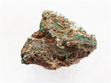 Premium Photo | Raw malachite copper ore stone on white marble