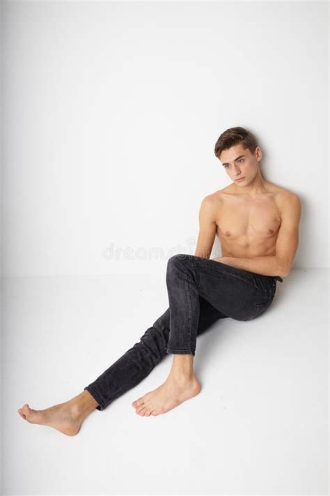 Man Sitting On The Floor Naked Torso Modern Style Self Confidence Stock