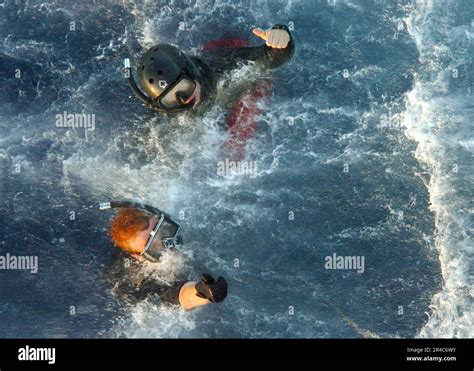 US Navy A Navy Search And Rescue SAR Swimmer And A Sailor Assigned To