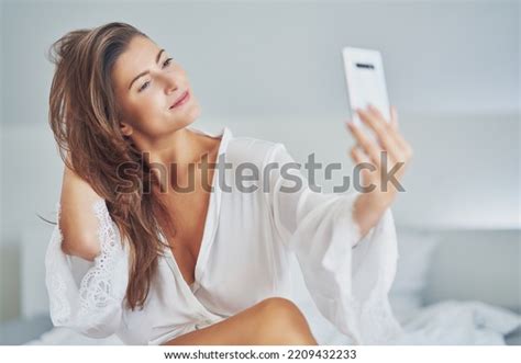 Brunette Sexy Girl On Bed Phone Stock Photo Shutterstock