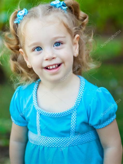 Small Blonde Girl In A Park Stock Photo Kmiragaya 8712393
