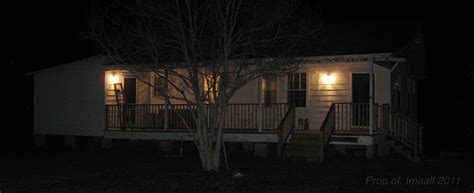 Two Men And A Little Farm Farmhouse Exterior At Night