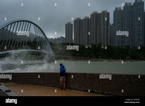 man watche  waves hitting  shore  tseung kwan  district