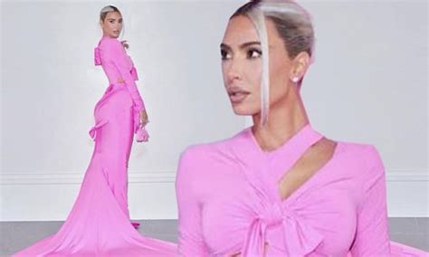 Kim Kardashian Puts Her Curves On Display In A Form Fitting Pink Dress