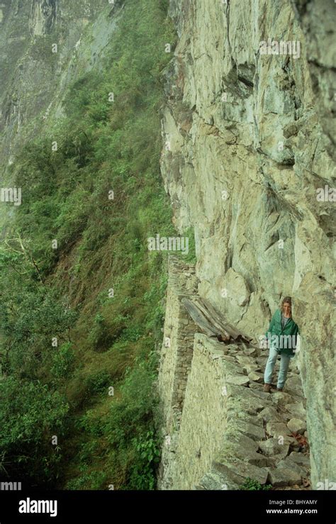 European Woman Backpacking Through Machu Picchu Stock Photo Alamy