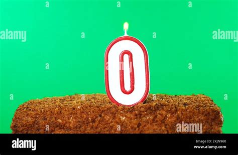 Cake with the number 0 lighted candle. Chroma key. Green Screen. Isolated Stock Video Footage ...