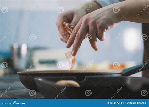 The Chef Fries Bacon In A Pan In The Restaurant Stock Photo Image Of