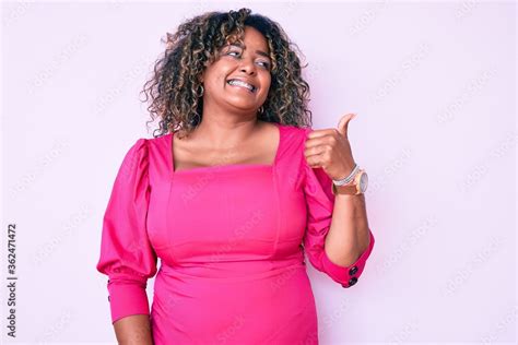 Young African American Plus Size Woman Wearing Casual Clothes Smiling