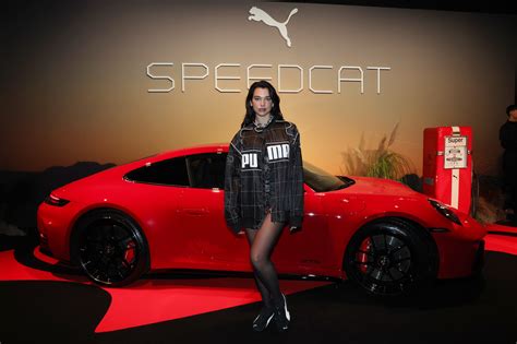 Dua Lipa Laces Up Black Puma Speedcat For Launch Event In Italy