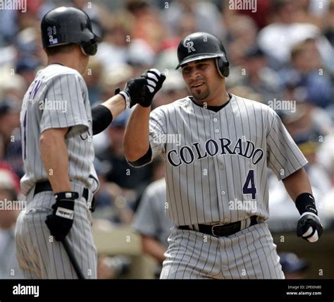 Colorado Rockies Luis Gonzalez 4 Is Congratulated By Cory Sullivan