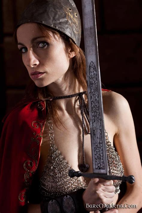 Nude Babe Posing With A Big Sword