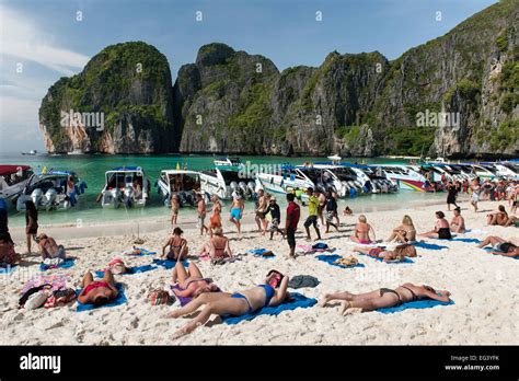 Tourist boats and tourists in Maya Bay on Koh Phi Phi Ley island in ...