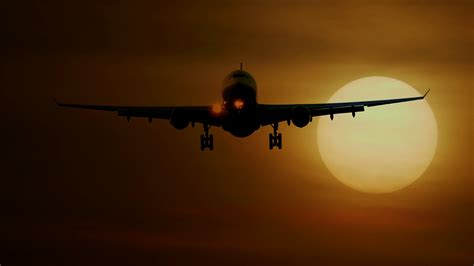 Airplane Flying In Front Of Large Sun At Stock Footage Sbv 330005790