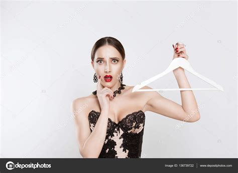 Surprised Shocked Brunette Woman In Girl In Lingerie With Hanger Thinking Choosing Not Having