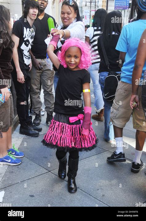 A young Nicki Minaj fan attends a album signing for 'Pink Friday: Roman Reloaded' at FYE Music ...