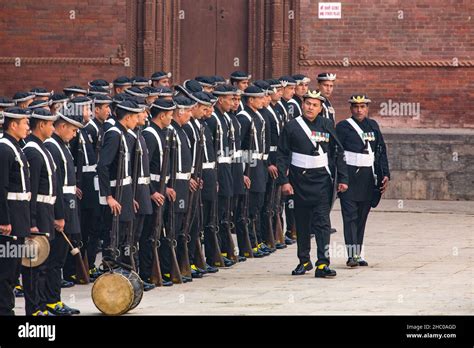 Two Gurkha Non Commissioned Officers With Their Troop In Vintage