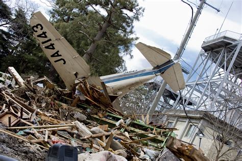 Work left to do: Destruction outside Sendai Airport > Pacific Air