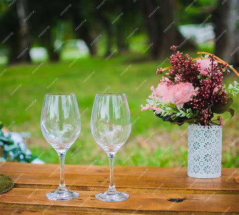 Premium Photo Two Glasses On A Wooden Table