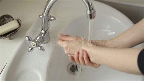 Girl Washing Her Hands In The Sink Close Up Only Hands And Sprays Of Water Stock Footage