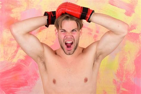 Premium Photo Guy With Naked Torso Wears Red Leather Boxing Gloves