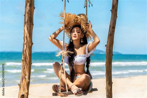 Asian Tourist Woman In Orange Bikini On The Beach Stock Photo Adobe Stock