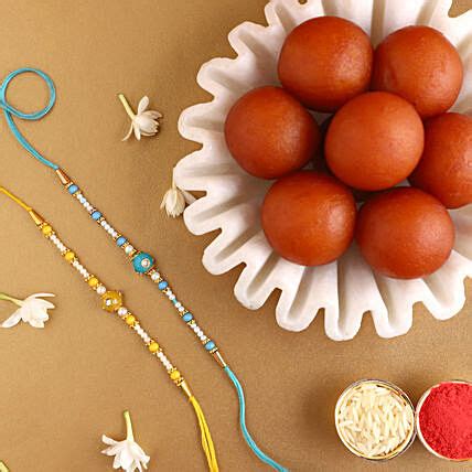 Online Sneh Vibrant Set Of 2 Pearl Rakhis With 1 Kg Gulab Jamun Tin