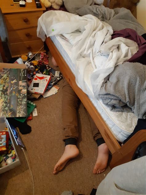 We were told to clean under are beds and my younger brother got stuck