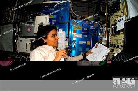 Astronaut Kalpana Chawla, STS-107 mission specialist, records data for ...