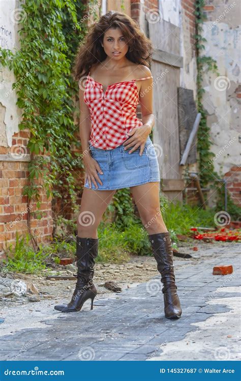 A Lovely Brunette Model Posing Outdoors With The Latest Fashions Stock Image Image Of Books