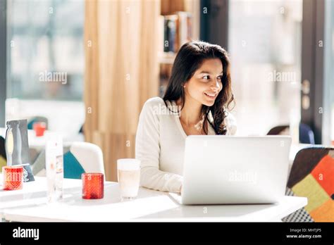 Beautiful Brunette Using Notebook Stock Photo Alamy