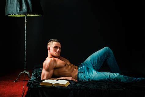 Premium Photo Muscular Shirtless Man In Bedroom Reading Macho Naked In Bed Sex And Relaxation