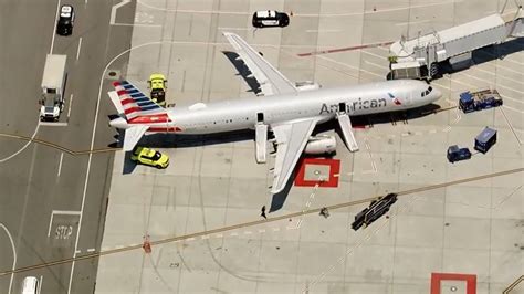 American Airlines passenger recounts evacuation from smoke on plane in ...