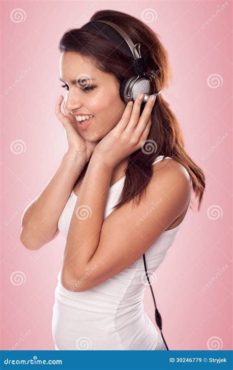 Brunette Woman Listening Tbrunette Woman Listening To The Music Wearing Headphones Stock Image