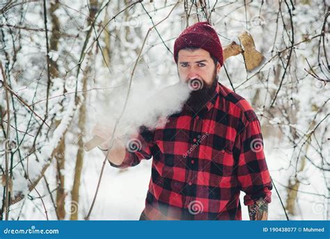 Bearded Lumberjack Smoking In Winter Forest Brutal Lumberjack With Ax