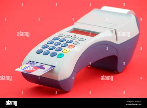 Credit Card Reader On A Red Background Stock Photo Alamy