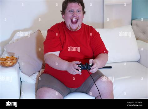 Fat Man Playing Video Games On Home Interior Background Stock Photo Alamy