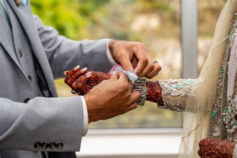 Indian Henna Mehndi On The Hand Of A South Asian Bride Stock Photo