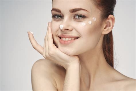 Premium Photo Woman With Face Cream Naked Shoulders Cosmetics Face Care